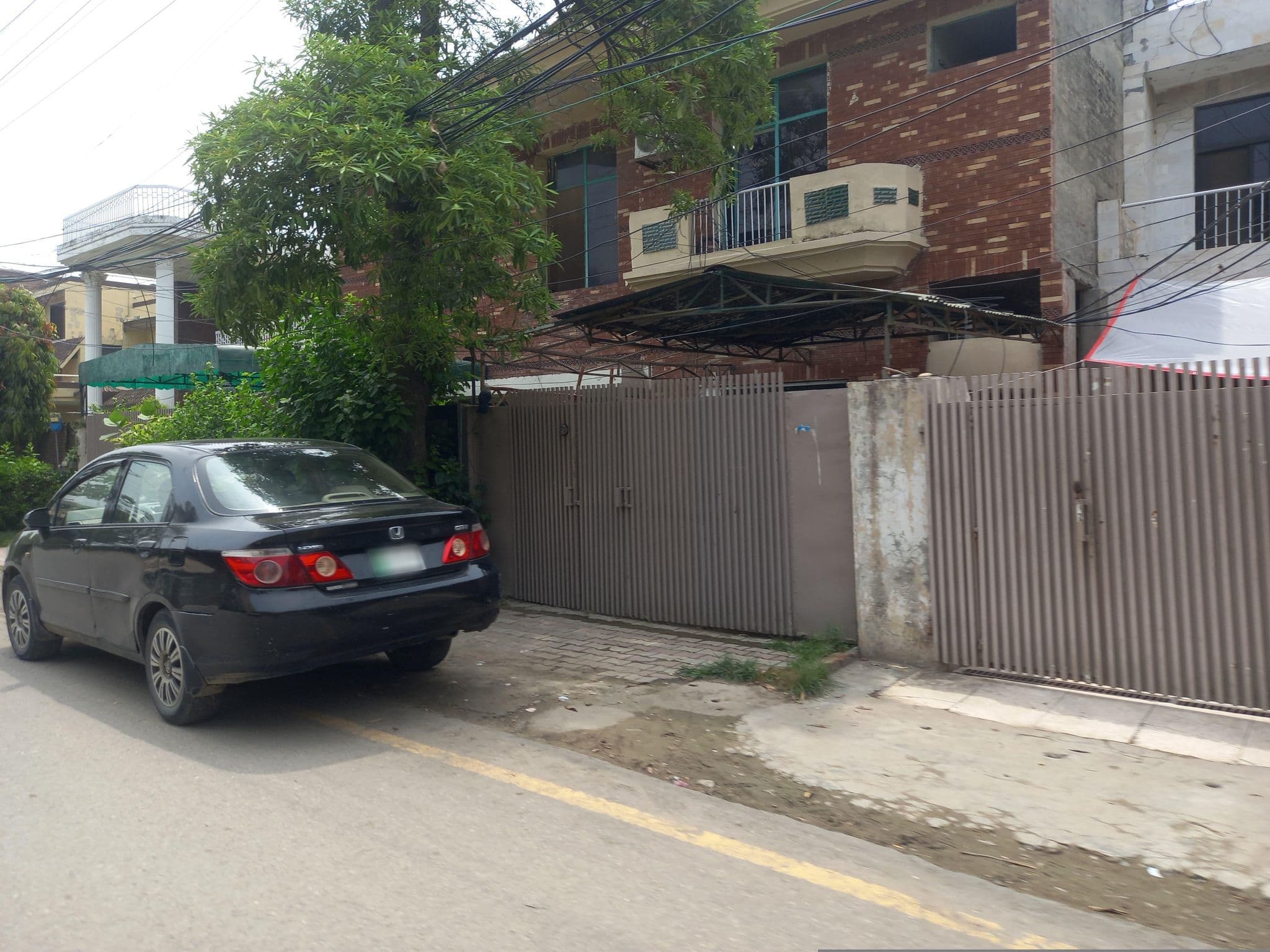 Street view near New Chancery Hotel II, Model Town — © hamzajutt (CC BY-SA · Mapillary)