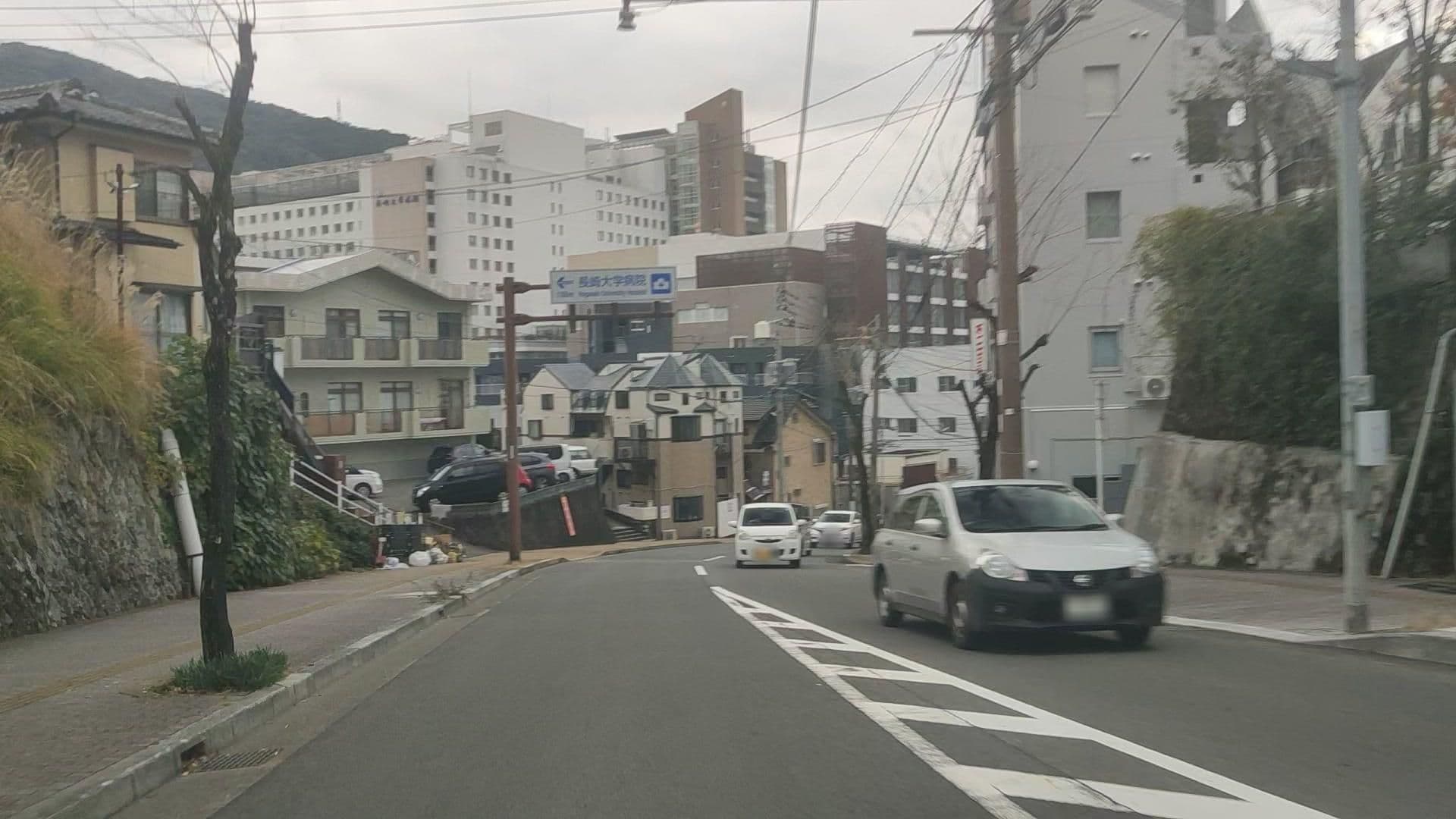 Street view near ゲストハウス(旧長崎医科大学配電室)（原爆遺構）, Nagasaki — © drivephotograph (CC BY-SA · Mapillary)