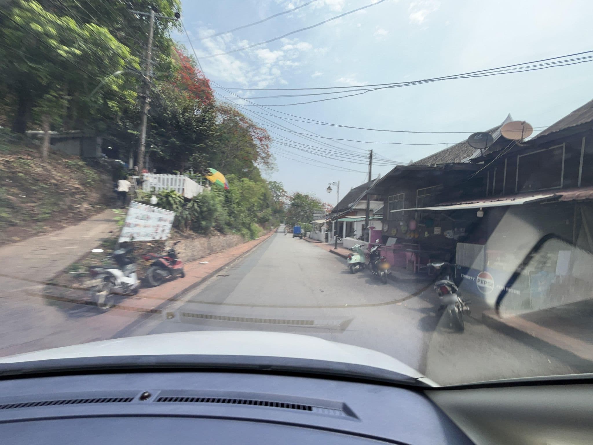 Street view near Phasith Guesthouse, Luang Prabang — © naokiosaka (CC BY-SA · Mapillary)