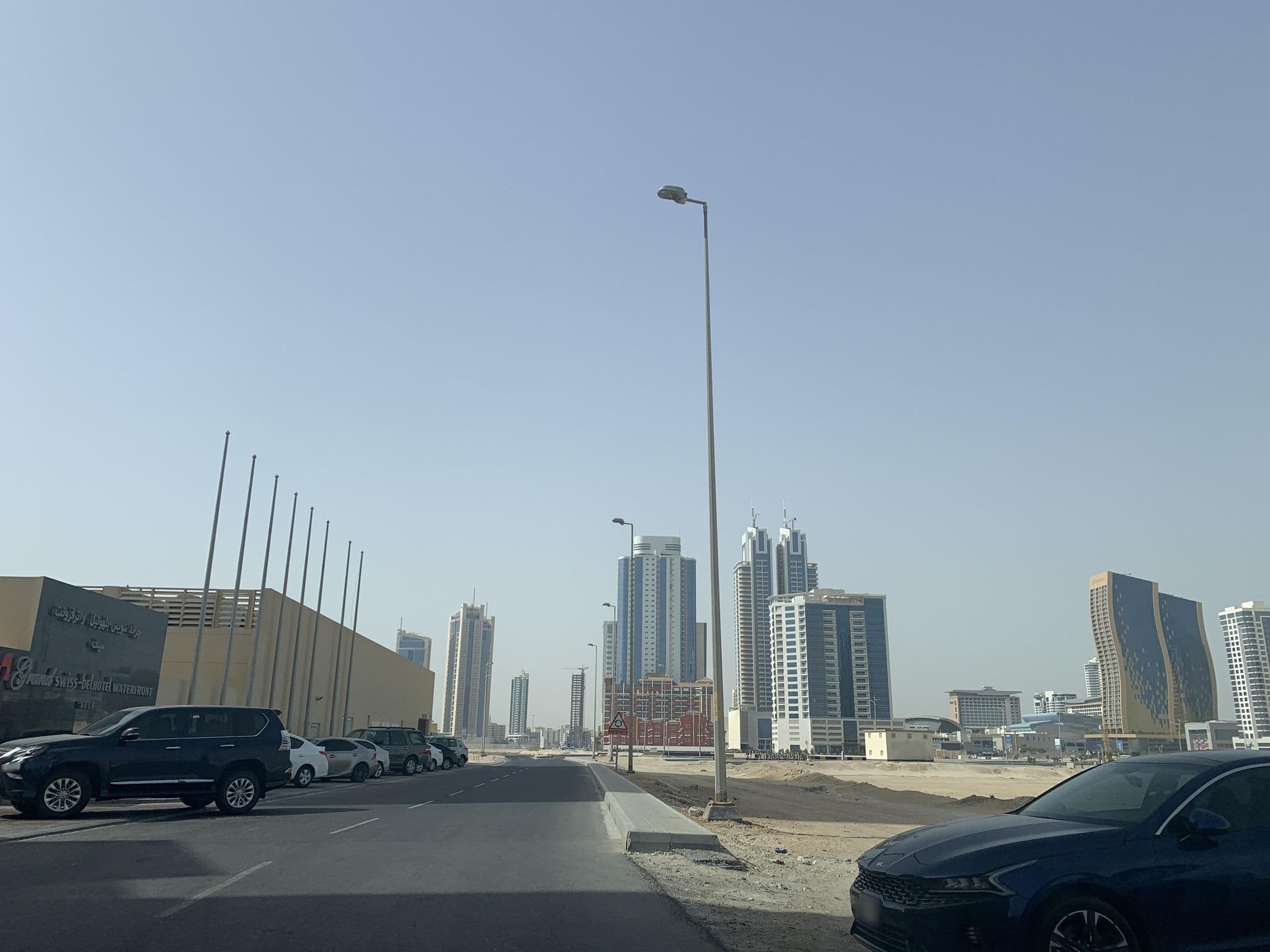 Street view near Grand Swiss-Belhotel Waterfront Seef, Bahrain, Sanābis — © sherif1234 (CC BY-SA · Mapillary)