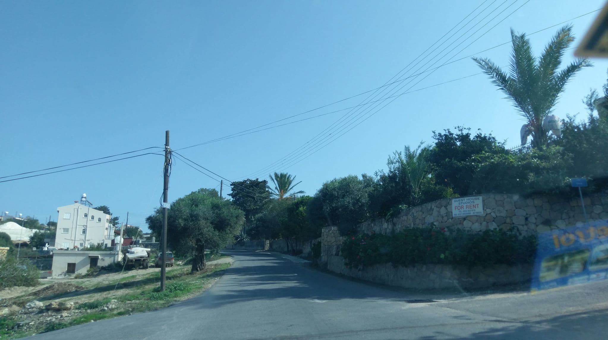 Street view near Sunset Guest House, Lápithos — © ozkanilyasaksu (CC BY-SA · Mapillary)