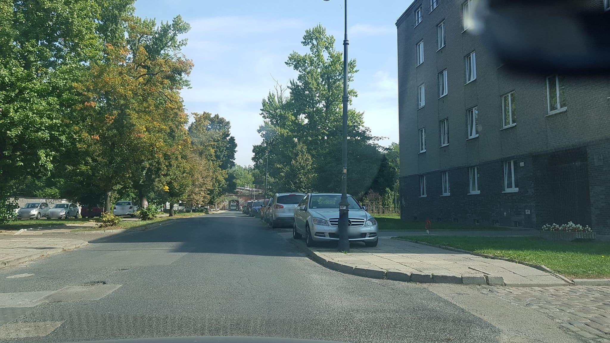 Street view near Studio Dymińska, Żoliborz — © kmajcher (CC BY-SA · Mapillary)