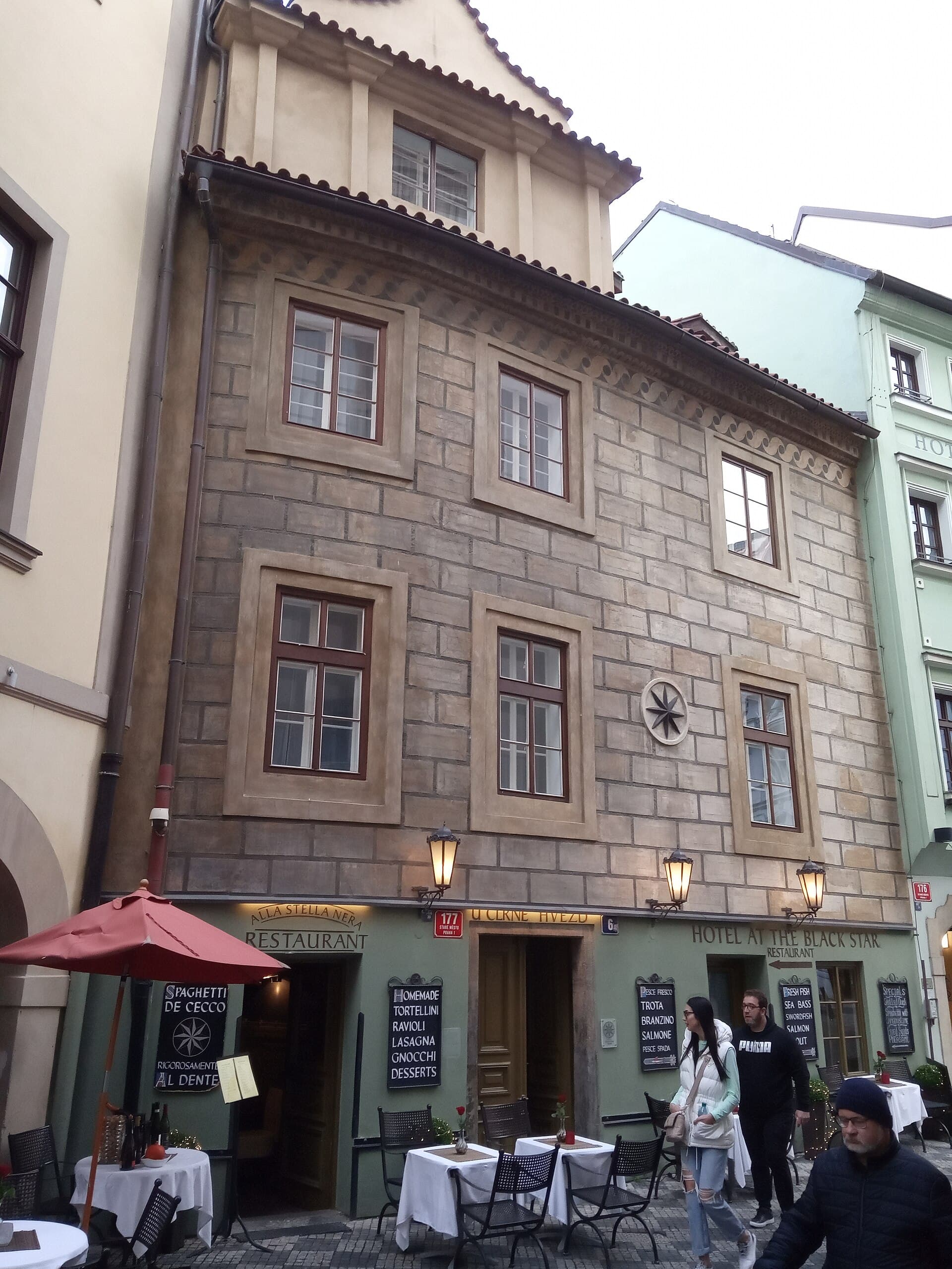 Charming Prague Apartments At the Black Star (via Wikimedia Commons, CC BY-SA 4.0)