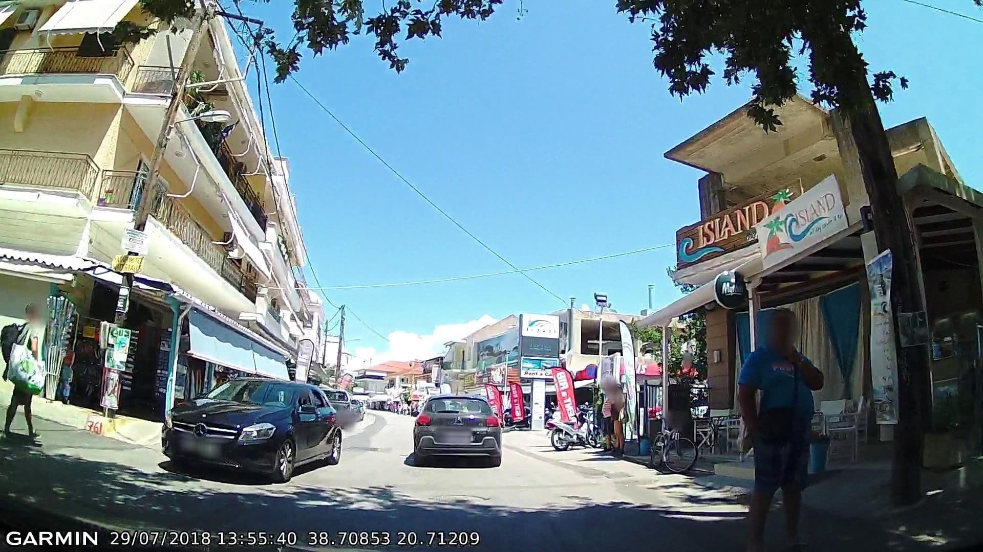 Street view near Happyland Hotel Apartments, Nidhríon — © pppetros (CC BY-SA · Mapillary)