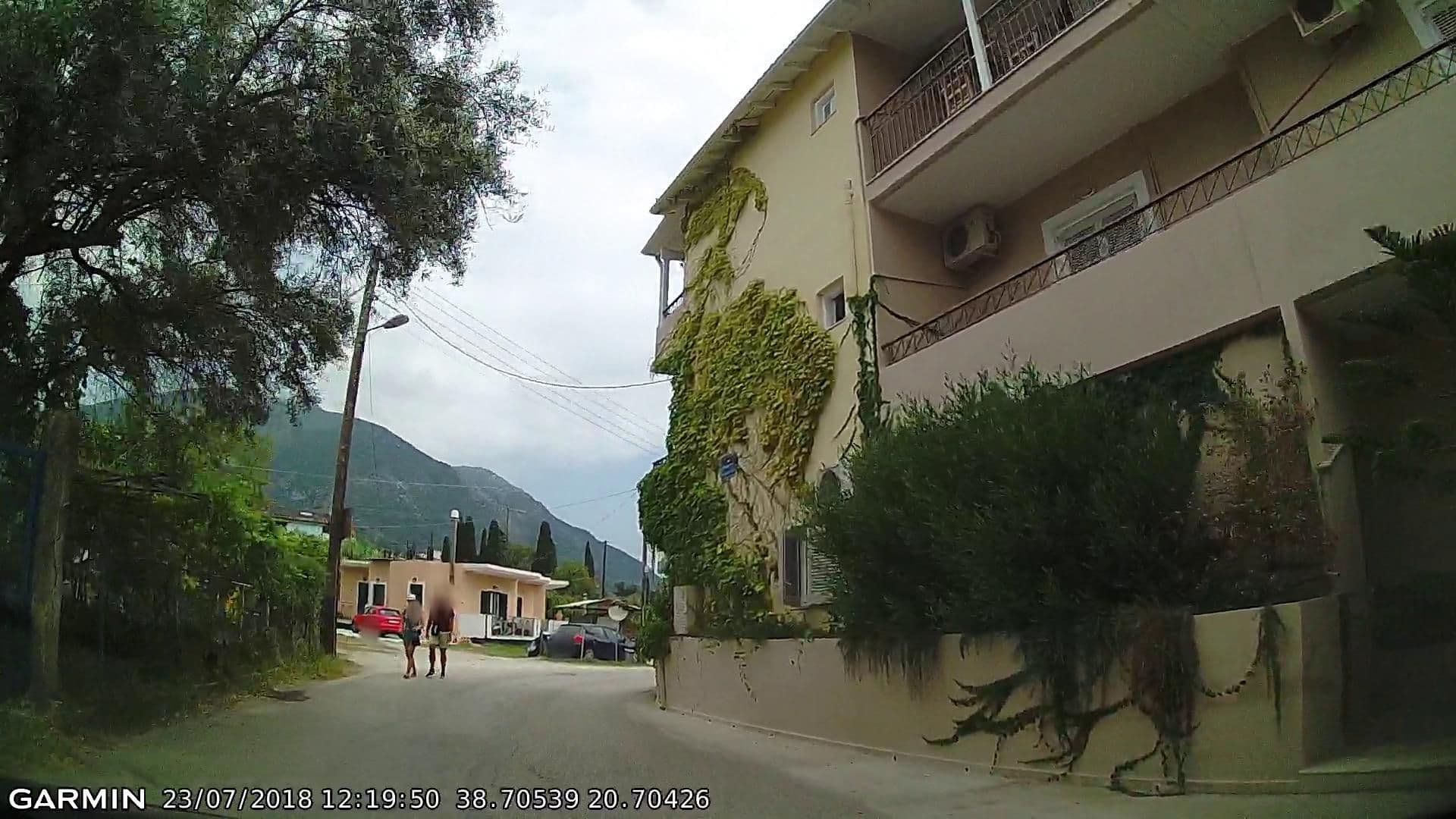 Street view near HappyLand Hotel, Nidhríon — © pppetros (CC BY-SA · Mapillary)