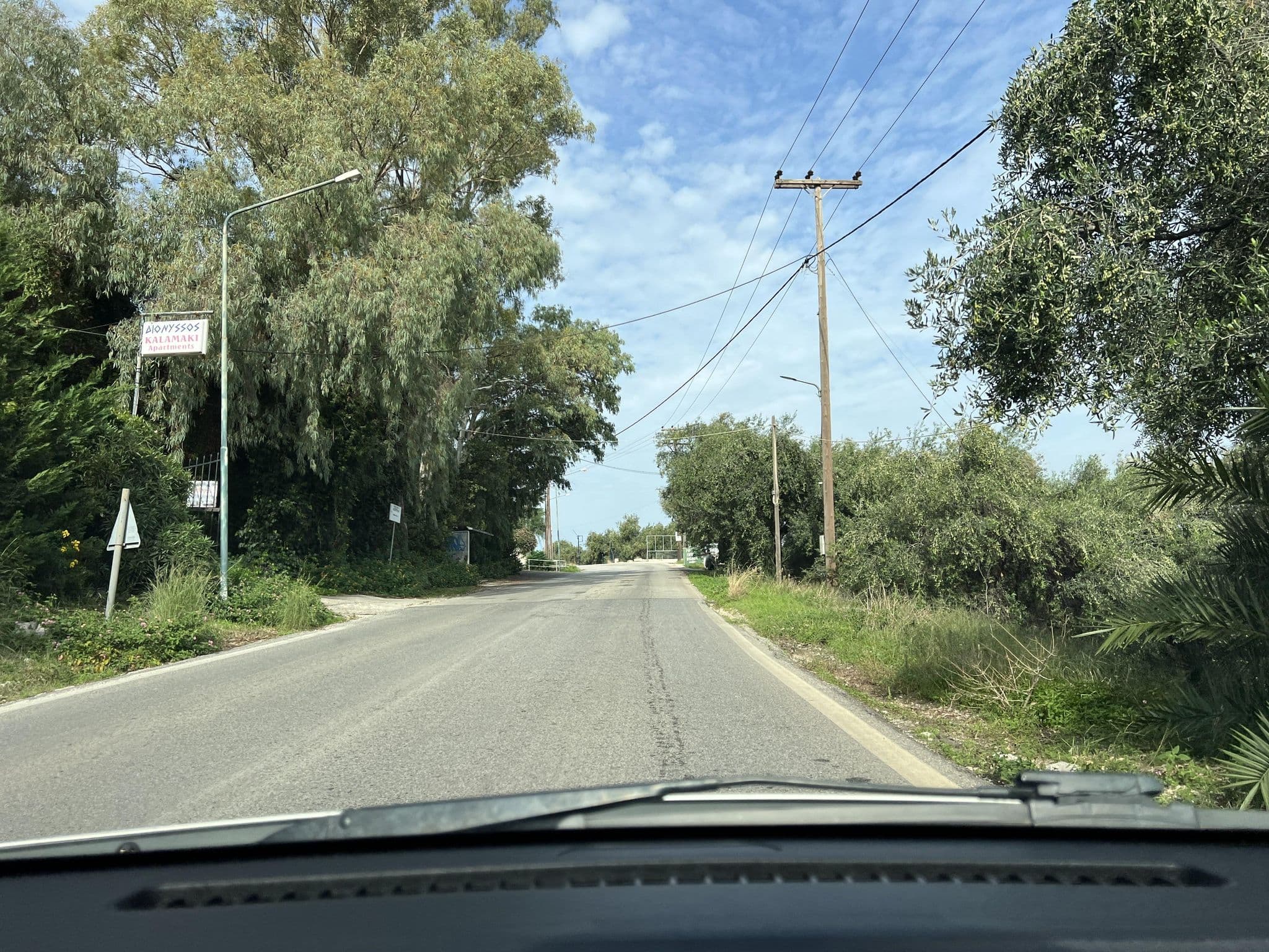 Street view near Dionysos Apartments, Acharávi — © VMConsulting (CC BY-SA · Mapillary)