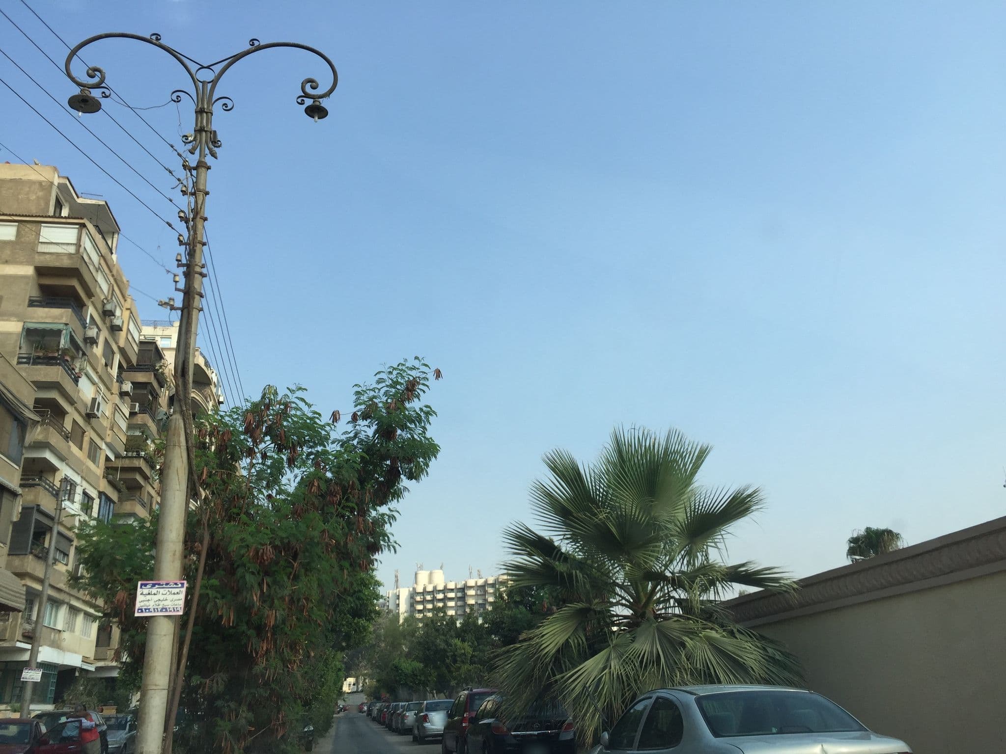 Street view near Le Ciel Hotel, Madīnat an Naşr — © galilu (CC BY-SA · Mapillary)