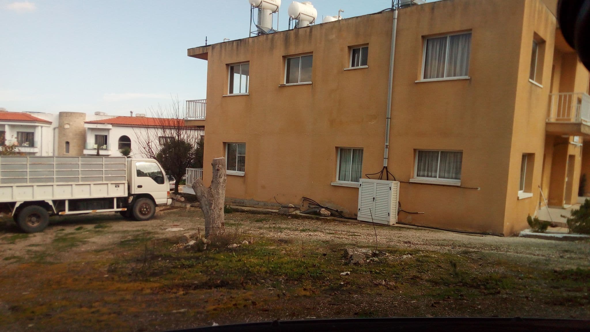 Street view near Drousia Holiday Apartments, Pólis — © stpkyriakou (CC BY-SA · Mapillary)