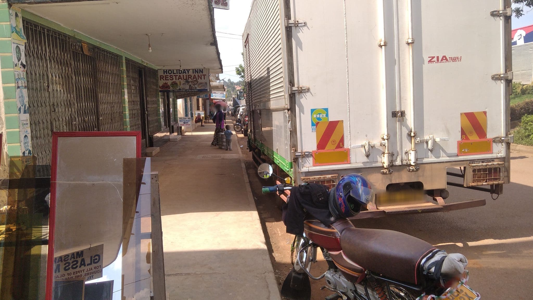 Street view near Holiday Inn Guest House, Masaka — © ajwang (CC BY-SA · Mapillary)